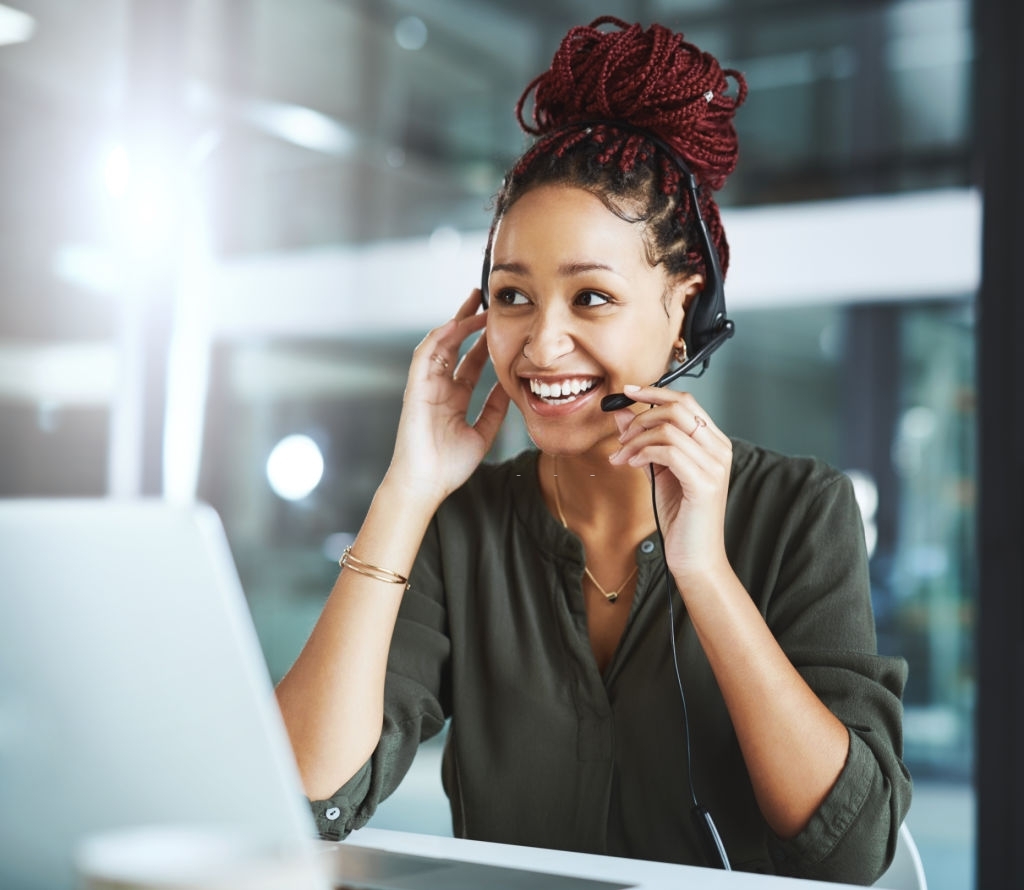 Shot of a young call centre agent working in an office